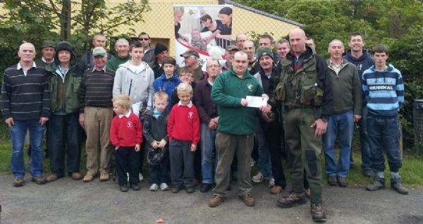 Fergal Diamond presents Ian Rowan with a cheque for �400 from Moyola Anglers